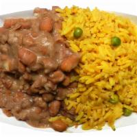 Mexican Rice and Beans · Yellow Mexican rice with refried pinto beans.