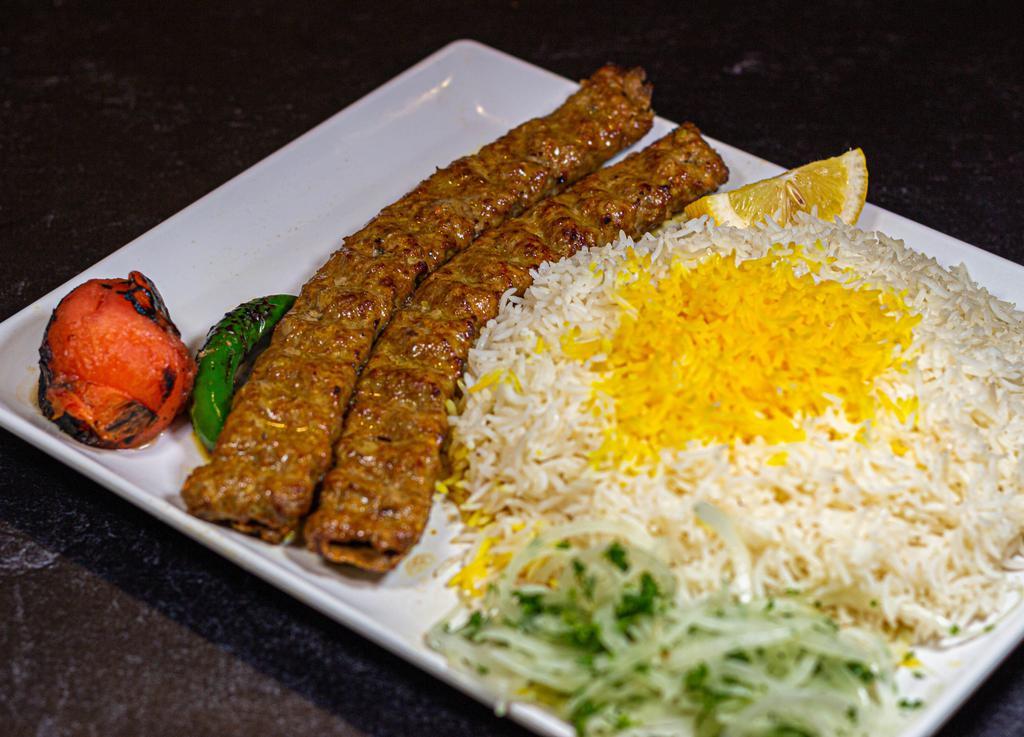 Beef Koobideh (Ground Beef) · Skewers of juicy ground beef charbroiled to perfection over open fire and served with Basmati rice with a side of grilled tomato