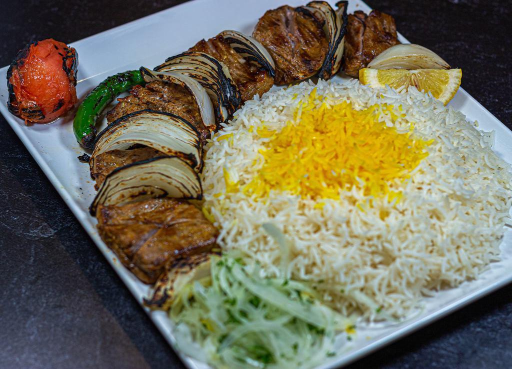 Lamb Shish Kabob (Lamb Kabob) · Kabob chunks of marinated lamb charbroiled to perfection over open fire. Served with Basmati rice, grilled tomato and grilled onion