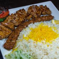 Shish Kabob Soltani (Our Signature Dish) · One skewer of ground beef and chunks of marinated beef charbroiled to perfection over an ope...