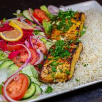 Salmon Kabob (Deliciousness)  · Salmon coated in house spices then charbroiled to cook. Served with Basmati rice and onion