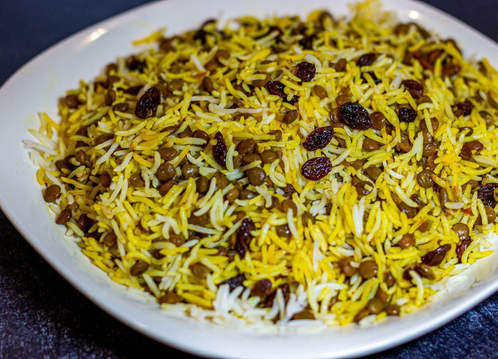 Persian Lentil Rice (Adas Polo)  · Basmati rice mixed with lentils, fried onion, sweet black raisins, and house seasoning.