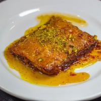 Baklava  · Rich sweet pastry made of layers of phyllo dough filled with chopped nuts and sweetened with...