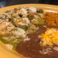 Camarones Los Cabos · Shrimp sauteed with mushrooms, covered with serrano sauce and topped with Monterey Jack chee...