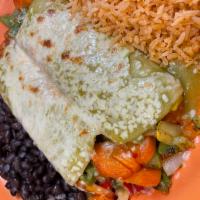 Veggie Enchiladas · Red, Yellow, Green peppers sautéed with mushrooms, onion, zucchini and squash topped with gr...
