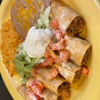 Taquitos Rancheros · Tacos made of corn tortillas rolled and filled with shredded beef or chicken deep-fried and ...
