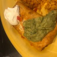 Chimichanga (not a combo) · Fried flour tortilla stuffed with beans and your choice of meat (Ground beef, shredded beef,...