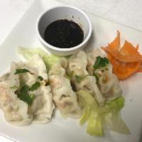 Steamed Vegetable Dumpling · 5 pieces. Cabbage, carrot, spinach, and Vermicelli wrapped with wheat flour and served with ...