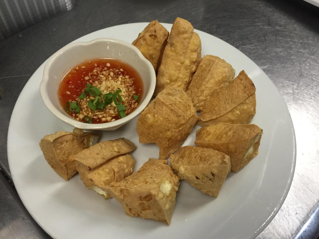 Fried Tofu · Fried tofu served with sweet chili sauce and topped with crushed peanut.