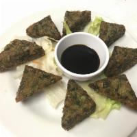 Scallion Pancake · 8 pieces. Traditional Thai vegetables and chives pancakes served with sweet soy sauce.