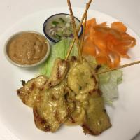 Chicken Satay · 4 pieces. Marinated grilled chicken skewers served with peanut sauce and cucumber onion sauce.