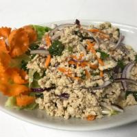 Larb Gai Salad · Ground chicken, red onion, carrot,  cilantro and chili lime dressing.