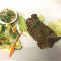 Grilled Beef · Marinated beef served with mixed vegetables, jasmine rice, and Thai spicy lime vinaigrette s...