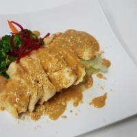 Grilled Chicken · Grilled chicken cutlet served with peanut sauce, mixed vegetables, and jasmine rice.