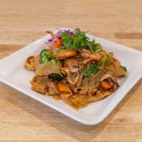 Pad See Ew · Soy Sauce  based flat rice noodles, egg, carrot, and broccoli with choice of protein