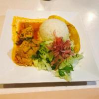 Seco de Gallina · Hen stew served w/ rice, avocado and fried sweet plantain