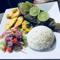 Trucha Frita / Fried Trout · Servidos con arroz, tostones y ensalada. / Served with rice, fried green plantains, and salad.
