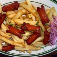 Salchipapas · Fried hot dog and french fries.