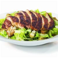 Caesar Salad · Crisp romaine lettuce tossed in our garlic Caesar dressing. Topped with crunchy croutons and...