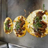 Tacos · 4 tacos on corn tortilla with onion and cilantro