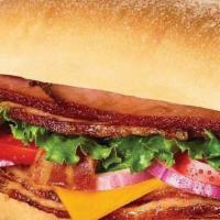 BBQ Smoked Stacker Sandwich · Honey Baked ham, bacon, cheddar cheese, lettuce, tomato, red onion and smoky BBQ sauce on ci...