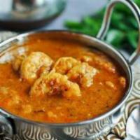 Surf & Turf Tikka Masala · Marinated shrimp and lightly seasoned chicken in Tikka Masala Sauce