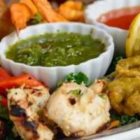 Mixed Appetizers · Two shami kebab, one vegetable samosa, two vegetable pakora, a chicken tikka with mint and t...