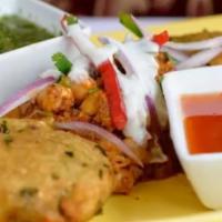 Aloo Tikki Chole · Potato pancakes served with chana.