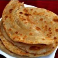 Aloo Paratha · Whole wheat bread stuffed with potatoes and spices.