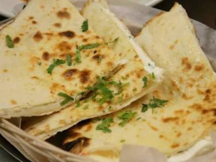 Paneer Naan · Naan stuffed with homemade cottage cheese, herbs and spices.