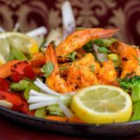 Tandoori Shrimp · Selected marinated prawns cooked in a clay oven. Served with vegetables and rice.