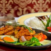 Tandoori Tofu · Marinated tofu grilled to perfection and cooked in a clay oven. Served with vegetables and r...