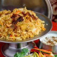 Chicken Biryani · Aromatic long grain basmati rice with chicken in a blend of herbs and spices.