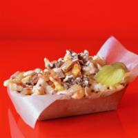 Super Smash Bacon Cheeseburger Fries · Our classic fries topped with melted cheddar cheese sauce, smoked bacon, grilled onions, gro...