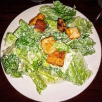 Caesar Salad · Romaine lettuce tossed with croutons and Parmesan cheese. 