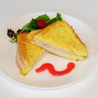 Monte Cristo Sandwich · Ham, Turkey and Swiss prepared like French toast.