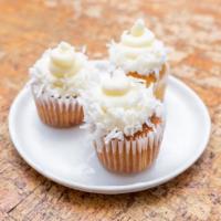 Coconut cupcakes · light and airy toasted coconut cake topped with coconut cream cheese frosting and shredded c...