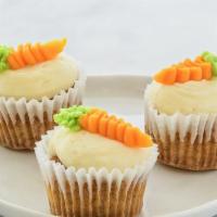 Carrot Cake cupcake · Sweet and spiced carrot cake topped with smooth cream cheese frosting