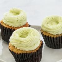 Coconut & lime cupcakes · Light and airy toasted coconut cake with creamy lime frosting