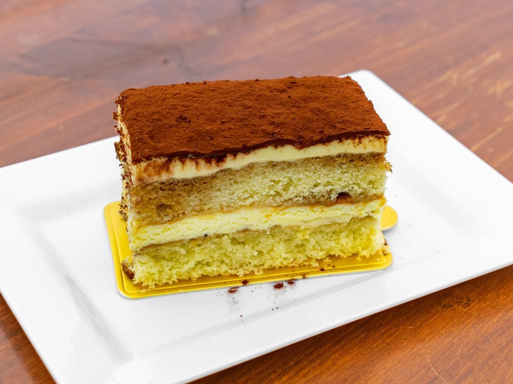 Tiramisu · Delicate genoise sponge cake soaked in espresso in between layers of decadent mascarpone sabayon filling.