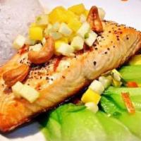 Salmon Mango Tango · Grilled fresh salmon fillet with mango-apple salsa and cashew nuts. Served with coconut rice.
