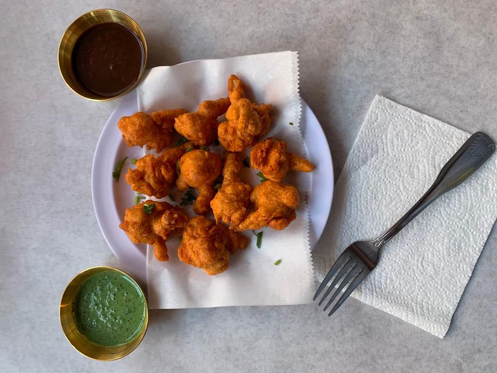 Mixed Pakora · Assorted fried vegetable fritters (cauliflower, onion, potato, and spinach).