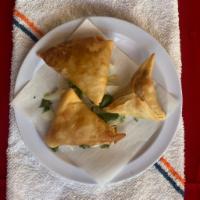 Chicken Samosa · 3 pieces. Rice battered crispy chicken spiced with green chilie and curry leaves.