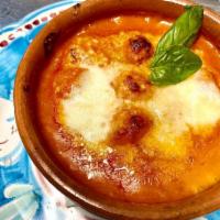 Gnocchi alla Sorrentina · Homemade gnocchi with tomato sauce meat and parmigiano reggiano cheese. Vegetarian.