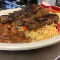  Carne Asada · Steak, rice, beans and salad.