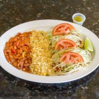  3 Combinacion De Tacos · Three tacos with rice and beans.