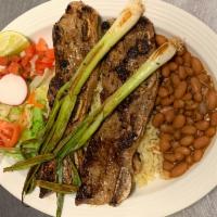 Steak ribs  · 2 grilled steak ribs, 2 scallions, Fresh Salad, rice, pinto beans, 2 homemade corn tortillas.