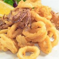 Calamari Frito · Crispy squid with golden cassava and creole sarza.