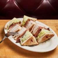 Turkey Club · Fresh roasted turkey, bacon, lettuce, and beefsteak tomato on toasted bread.