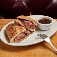 French Dip Sandwich · Shaved prime slow-cooked roast beef dipped in au jus on a hero with horseradish sauce and au...